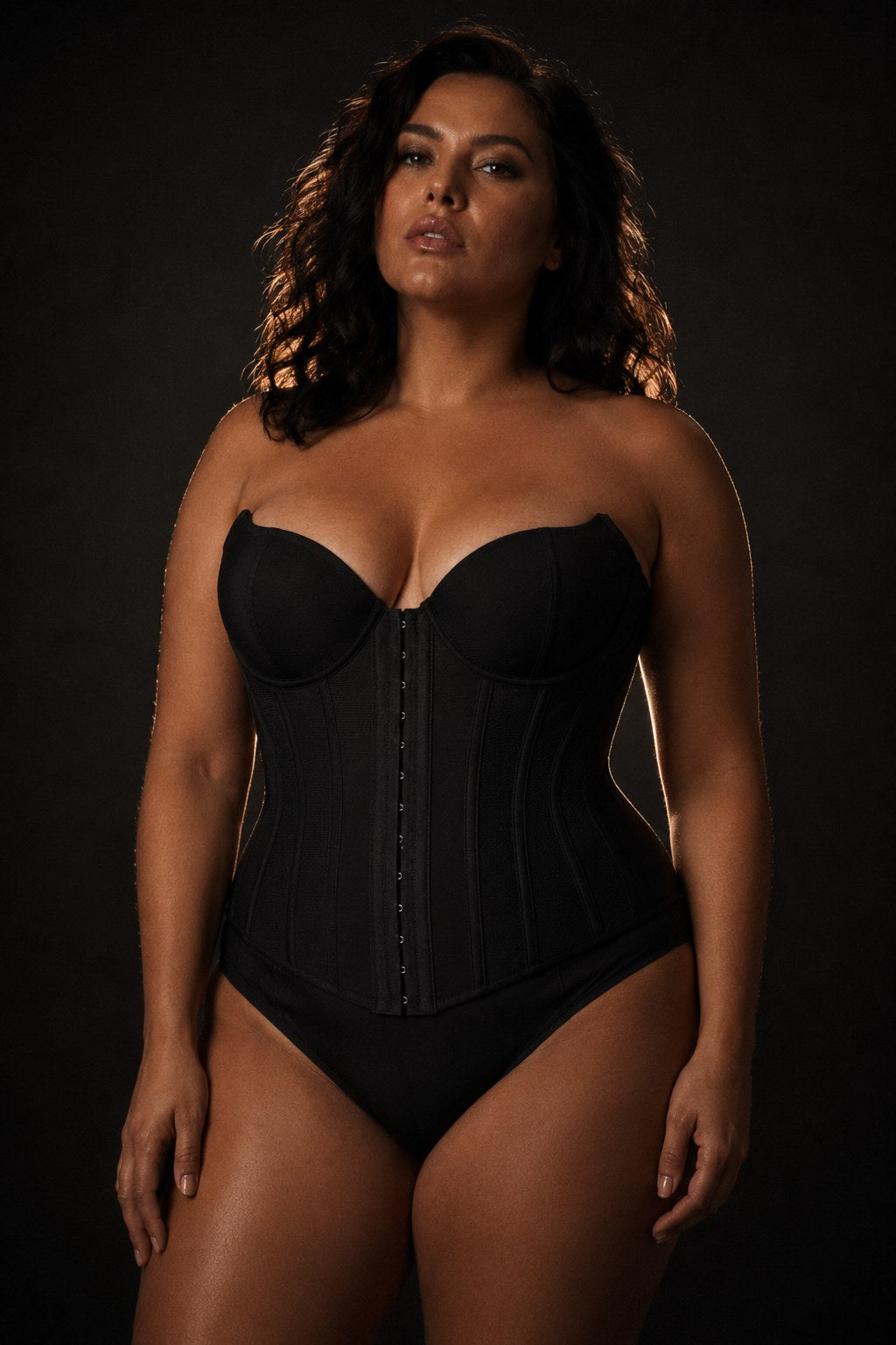 The Overbust Cincher — structured, worn low-lit.